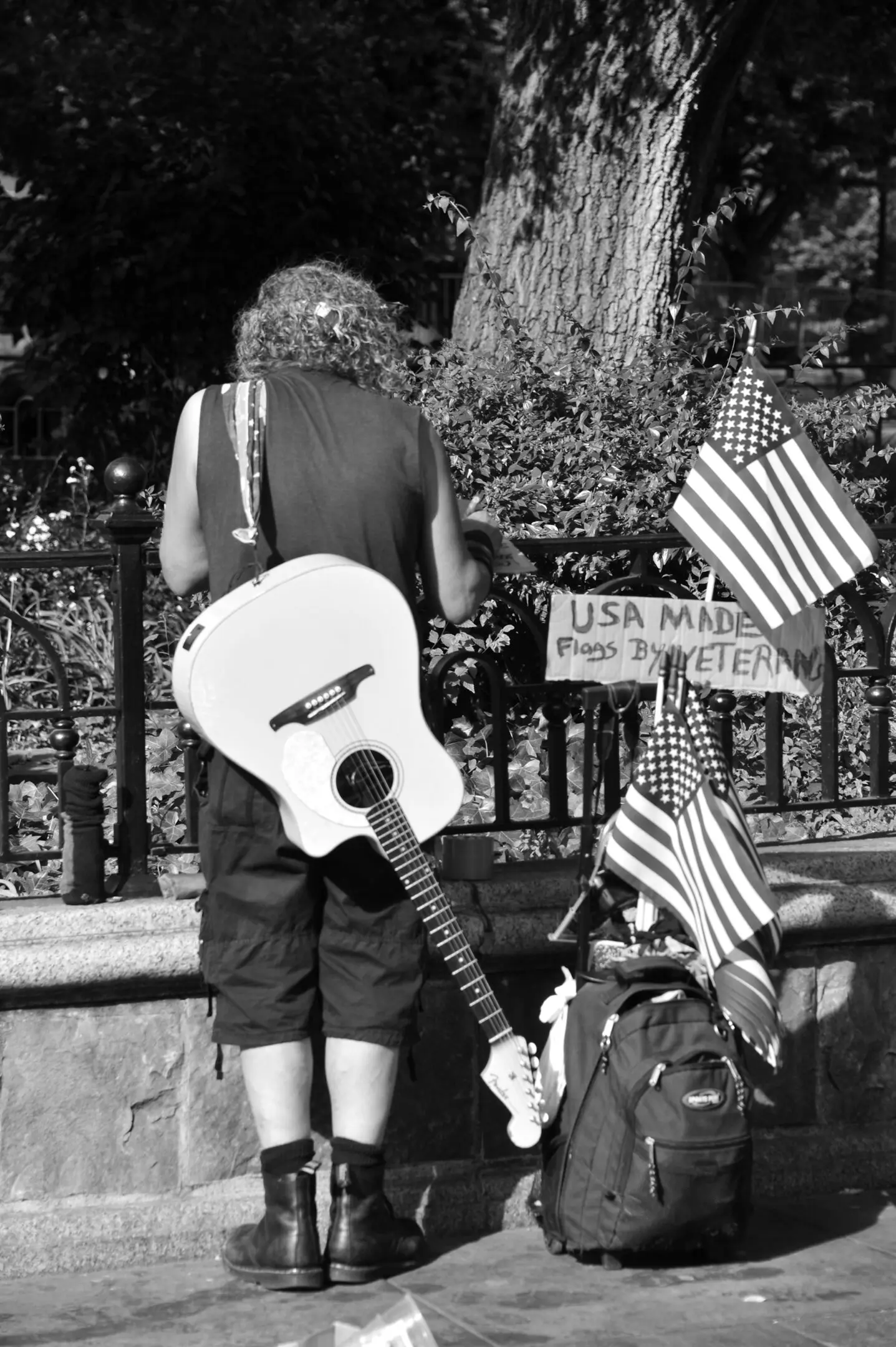 Musician with guitar and American flags